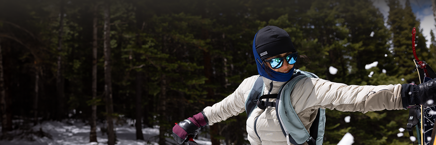 header image of woman in wintery landscape wearing a neck tube